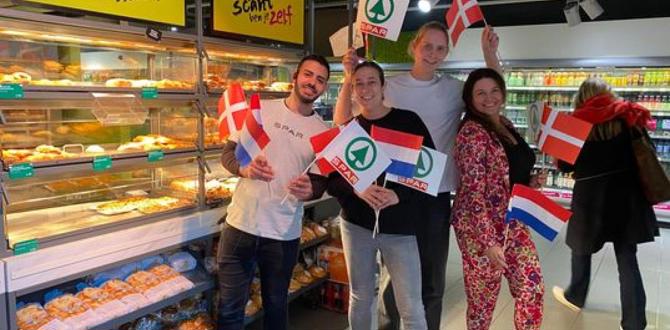 Fire personer holder danske og hollandske flag i et supermarked med bagværk i disken