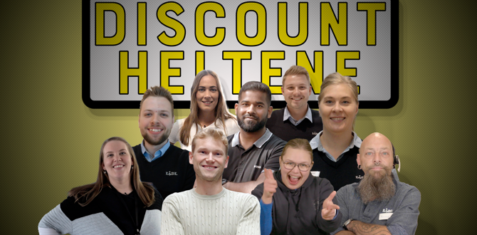 Gruppe medarbejdere samlet foran gult skilt med teksten Discount Heltene